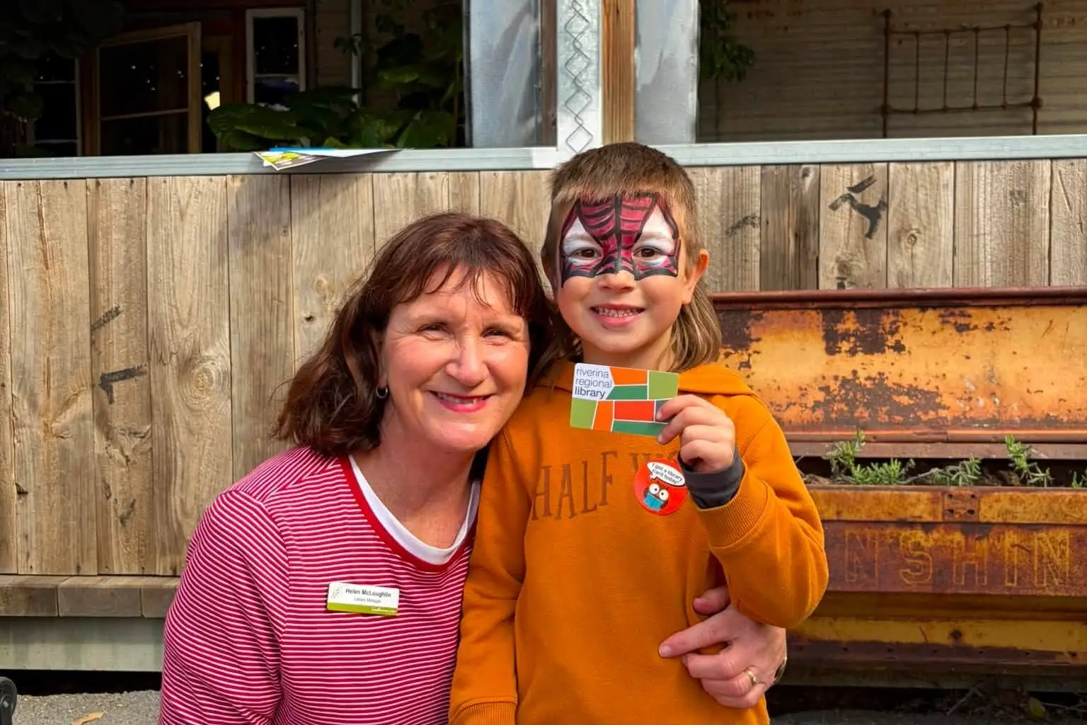 <p>Coolamon\\u2019s newest library member proudly displays his membership card with library manager, Helen McLoughlin. </p>\\n