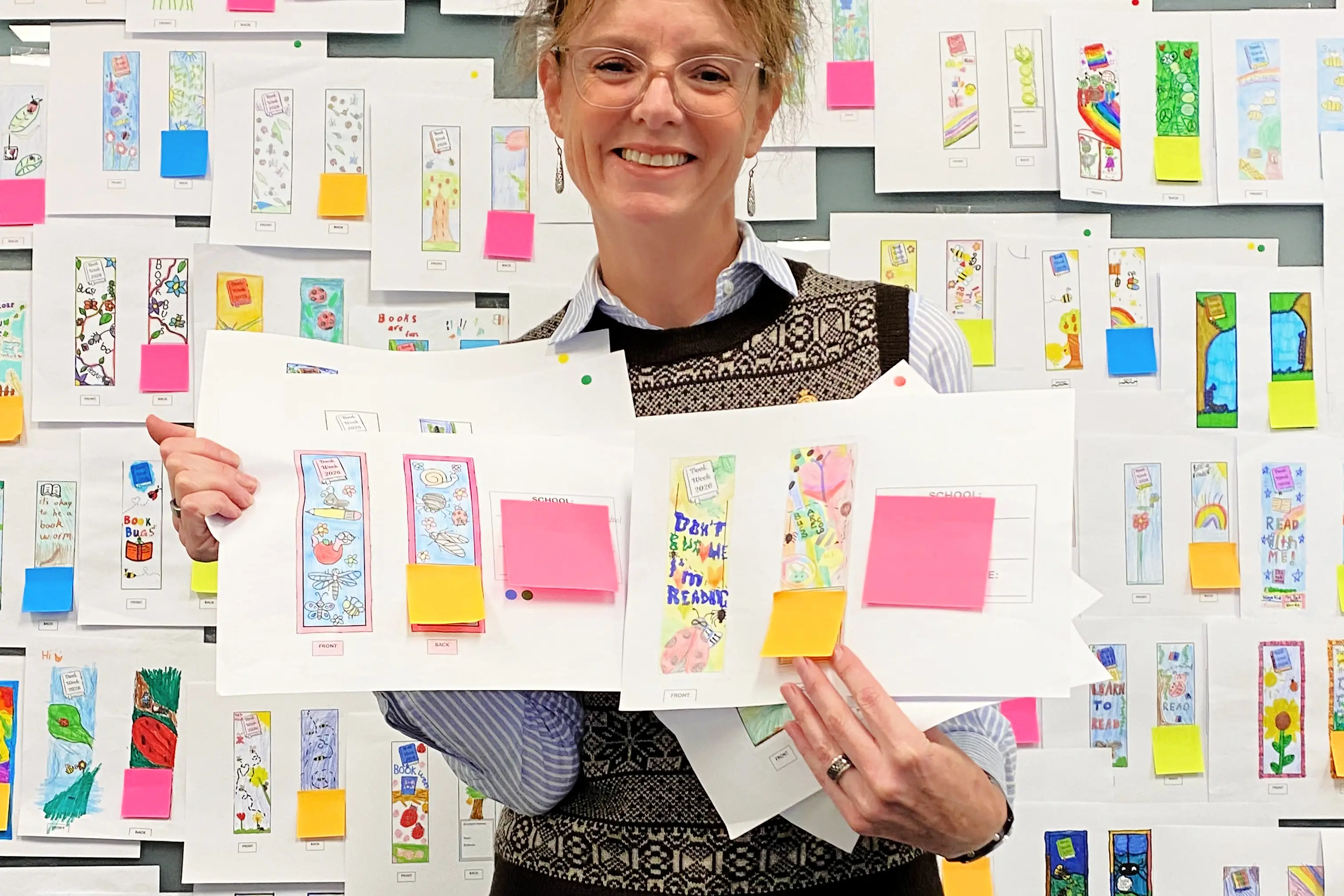 <p>Steph holding the winners with a small sample of the entries</p>\\n