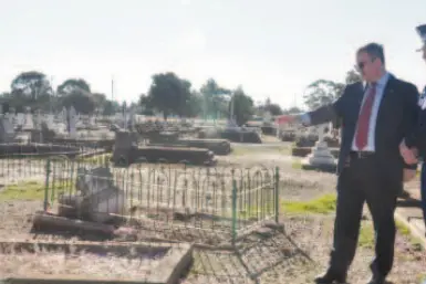 <p>Temora Shire Mayor Rick Firman visited the damaged graves with Sergeants Brent Fletcher and Gerard Horsley at a previous anniversary of the vandalism, which took place at the cemetery.</p>\\n