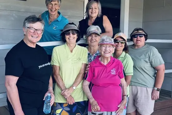 <p>Eleanor Brown pictured here with the ladies golf community.</p>\\n